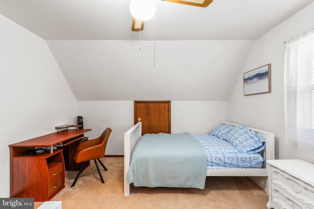 bedroom with light carpet, ceiling fan, and vaulted ceiling