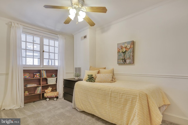 bedroom featuring visible vents, crown molding, and carpet floors