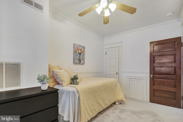 bedroom with visible vents, carpet floors, and ornamental molding