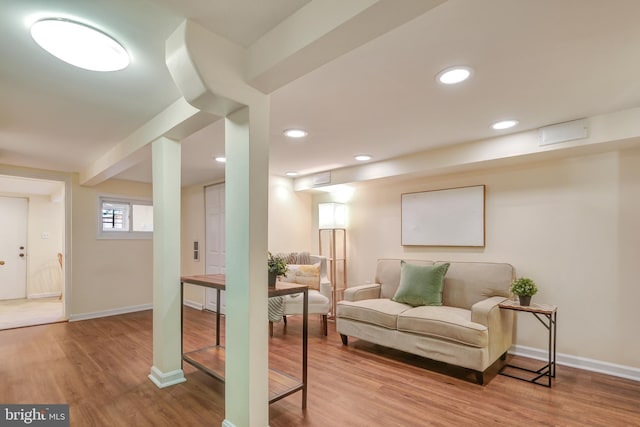 interior space featuring recessed lighting, wood finished floors, and baseboards