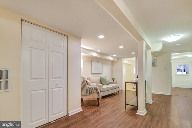 sitting room featuring recessed lighting, baseboards, and wood finished floors