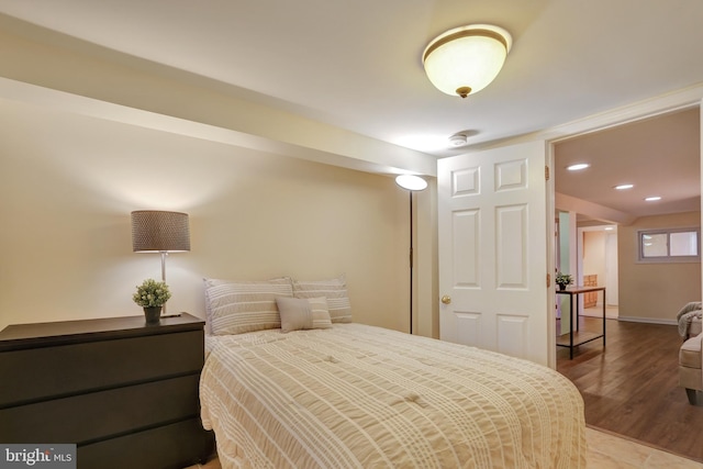 bedroom featuring recessed lighting, baseboards, and wood finished floors