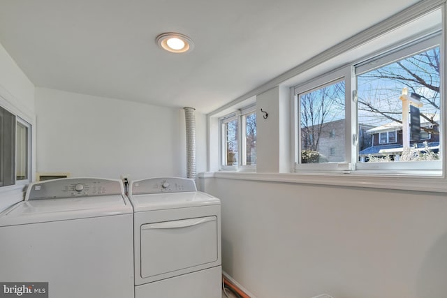 laundry area with laundry area and washer and clothes dryer