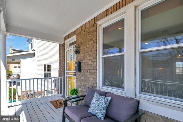 wooden terrace featuring a porch