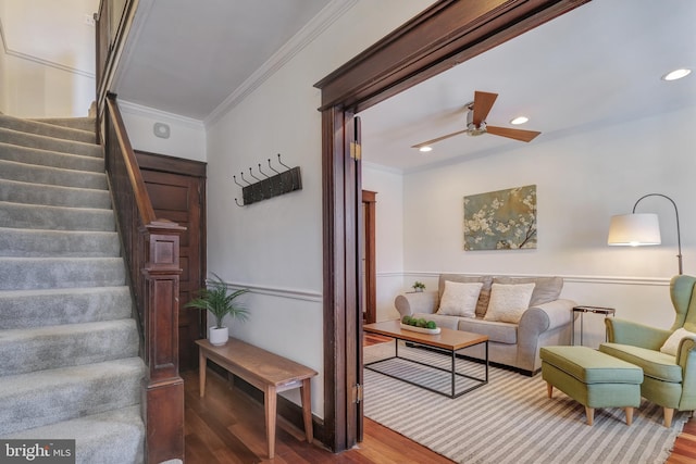 interior space with recessed lighting, wood finished floors, ornamental molding, and a ceiling fan