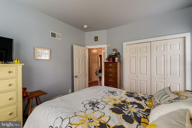 bedroom with visible vents and a closet