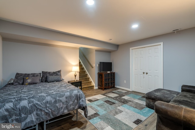 bedroom featuring recessed lighting, baseboards, and wood finished floors