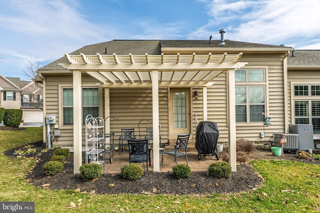 back of property with a patio and a pergola