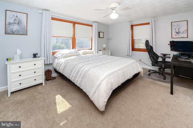 bedroom with baseboards, carpet, and a ceiling fan