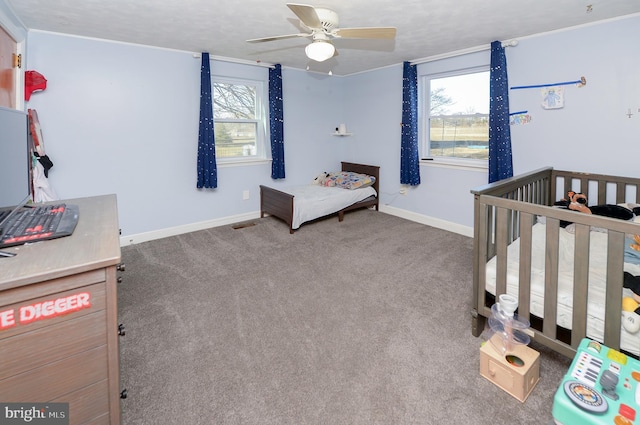 bedroom with baseboards, carpet floors, and ceiling fan