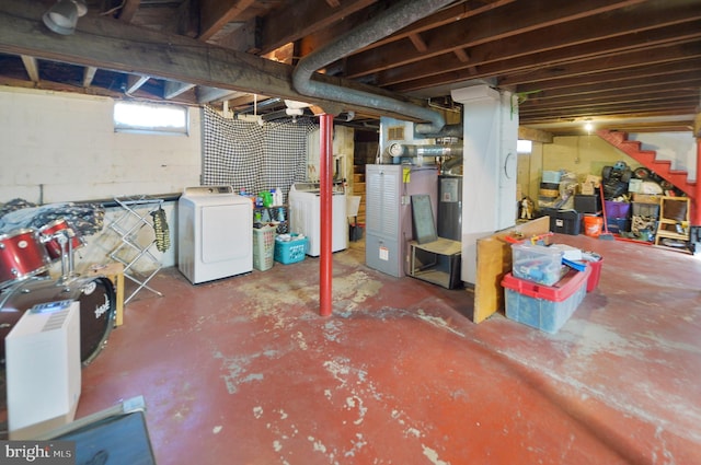 basement with stairway and washing machine and clothes dryer