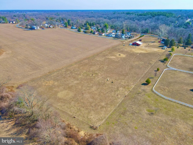 aerial view with a rural view and a wooded view