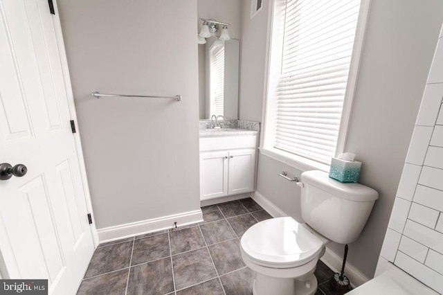 full bath featuring vanity, visible vents, baseboards, tile patterned flooring, and toilet