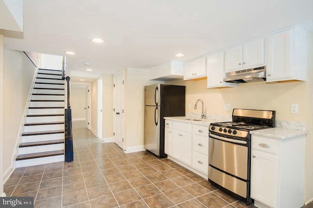 kitchen featuring a sink, white cabinets, under cabinet range hood, and stainless steel appliances