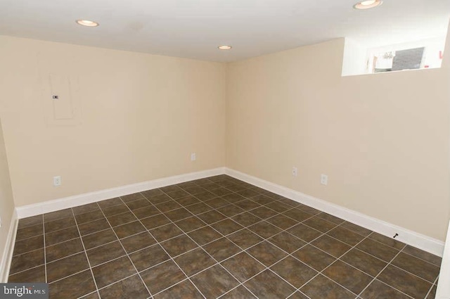 basement with recessed lighting and baseboards