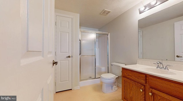 full bath with visible vents, toilet, a stall shower, and vanity