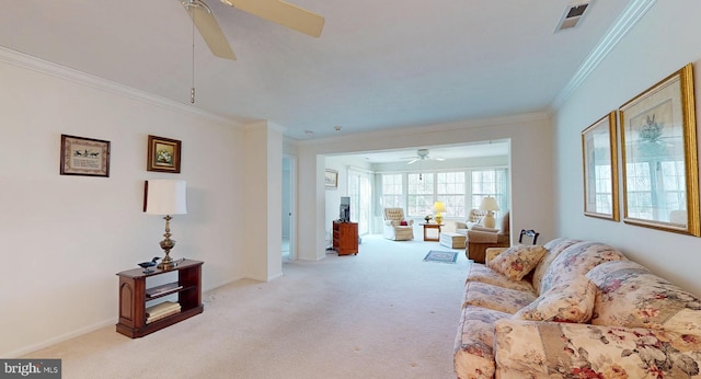 living room featuring light carpet, ornamental molding, and ceiling fan