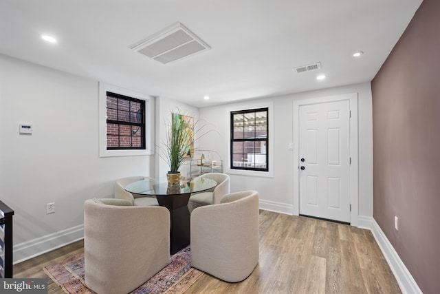 dining area with recessed lighting, light wood-style floors, visible vents, and baseboards