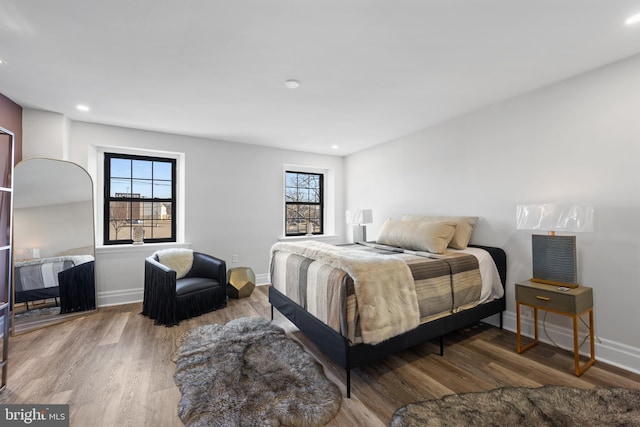 bedroom featuring recessed lighting, baseboards, and wood finished floors