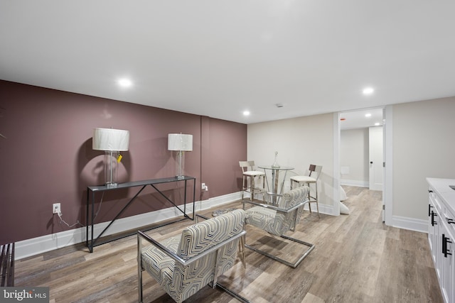 interior space featuring recessed lighting, light wood-type flooring, and baseboards