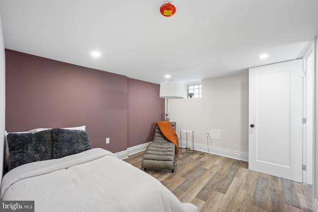 bedroom featuring recessed lighting, baseboards, and wood finished floors