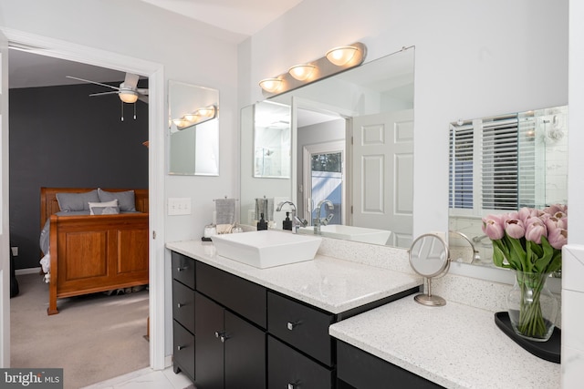 bathroom featuring connected bathroom, ceiling fan, and vanity