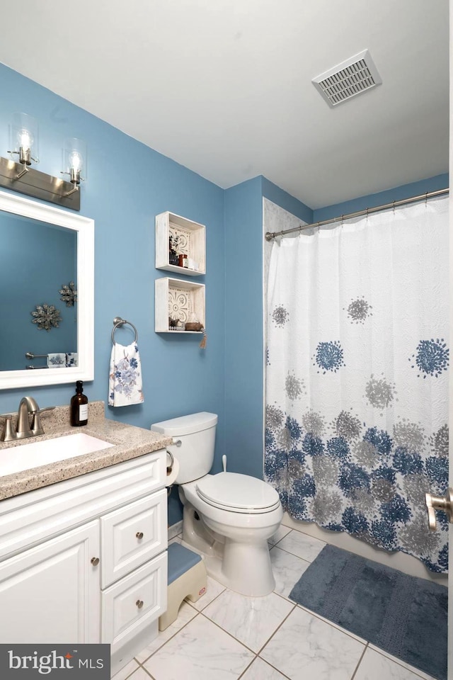 bathroom with visible vents, toilet, marble finish floor, curtained shower, and vanity