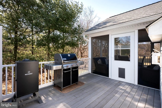 wooden deck featuring grilling area