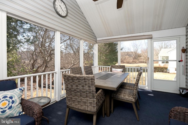 sunroom / solarium featuring lofted ceiling and ceiling fan