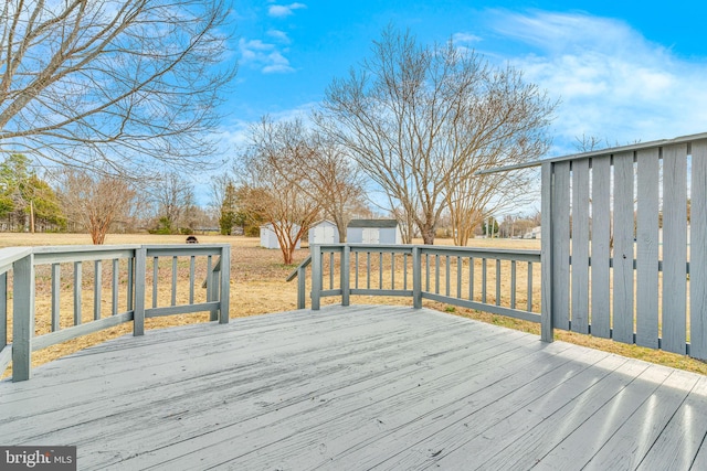 deck with a storage shed and an outdoor structure