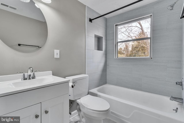 bathroom featuring vanity, toilet, visible vents, and shower / bath combination