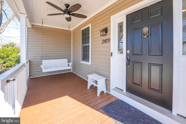 property entrance with covered porch and ceiling fan