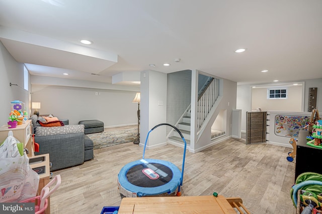 rec room with recessed lighting, baseboards, and light wood-style floors