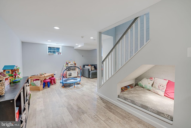 rec room featuring recessed lighting and wood finished floors