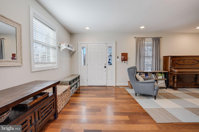 foyer featuring recessed lighting and wood finished floors