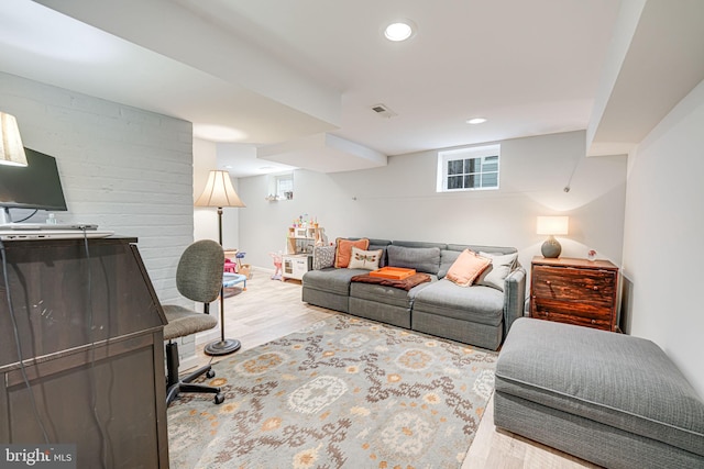 living area featuring recessed lighting, wood finished floors, visible vents, and baseboards