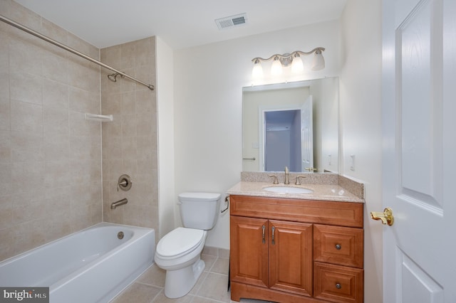 full bath with vanity, washtub / shower combination, visible vents, tile patterned flooring, and toilet