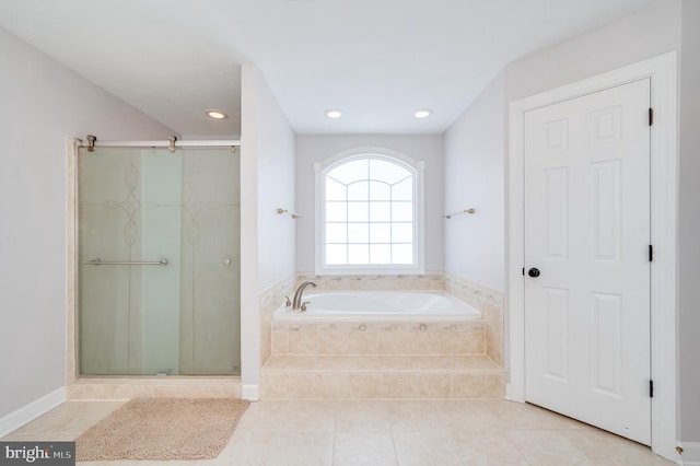 full bath featuring tile patterned flooring, a shower stall, a garden tub, and recessed lighting