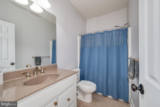 bathroom featuring tile patterned flooring, toilet, vanity, and a shower with curtain