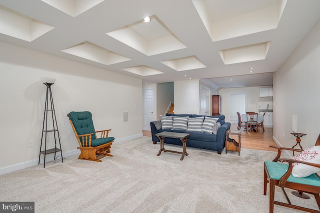 living room with light carpet and baseboards