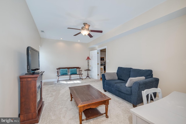 living room with baseboards, visible vents, recessed lighting, ceiling fan, and light carpet