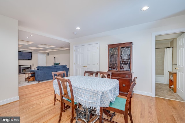 dining room featuring recessed lighting, light wood-style flooring, and baseboards