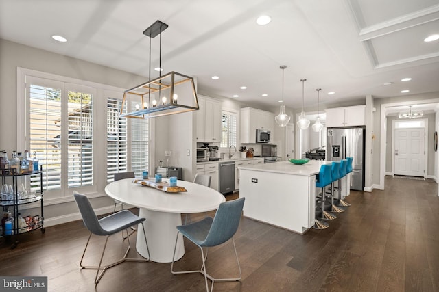 dining space featuring recessed lighting, baseboards, and dark wood-type flooring