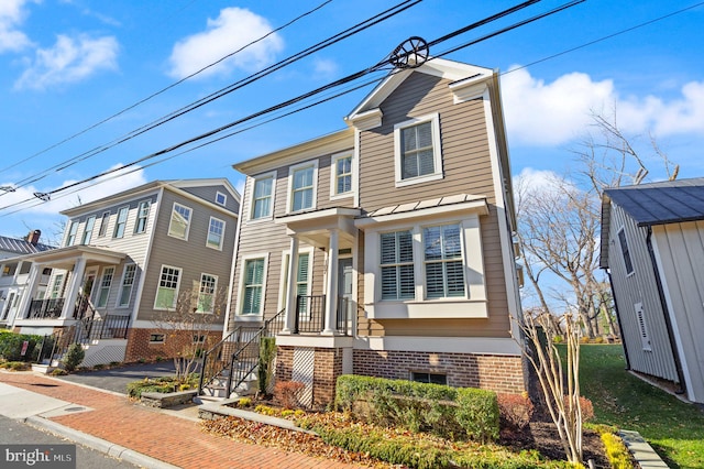 view of front of house featuring brick siding