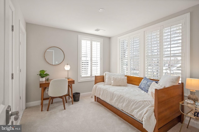 interior space featuring carpet flooring, visible vents, and baseboards