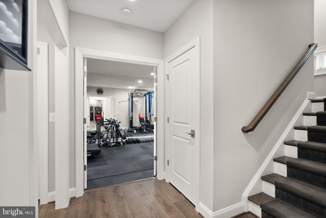 interior space with baseboards and wood finished floors