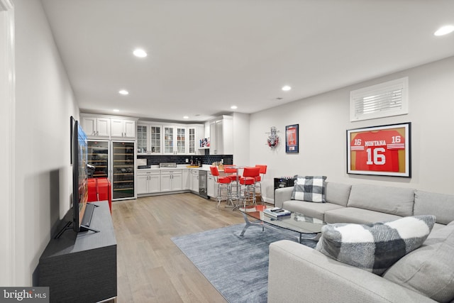 living area featuring recessed lighting and light wood-style floors