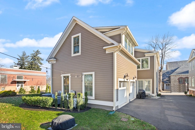 view of side of home featuring a lawn