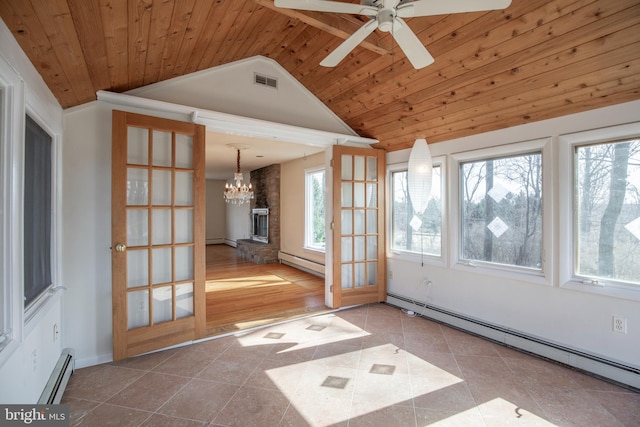 unfurnished sunroom featuring baseboard heating, wooden ceiling, and visible vents