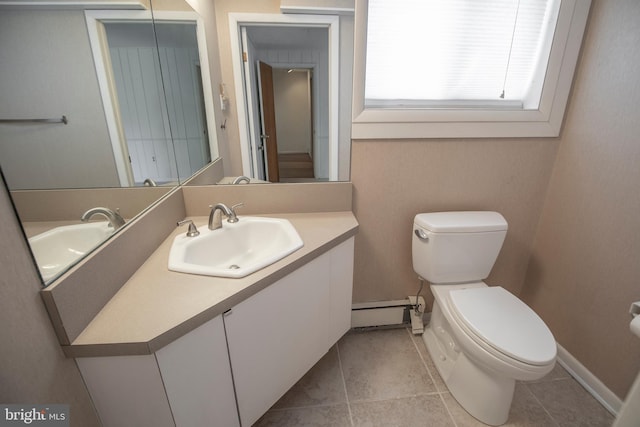 bathroom featuring tile patterned floors, a baseboard radiator, toilet, and vanity